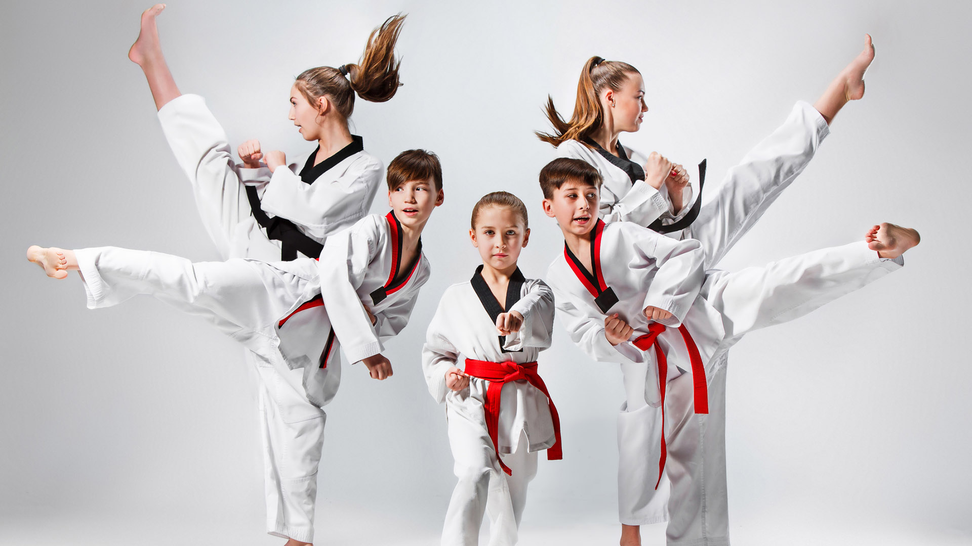 The studio shot of group of kids training karate martial arts